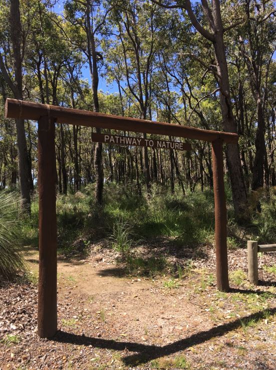 wooden entrance to bushland