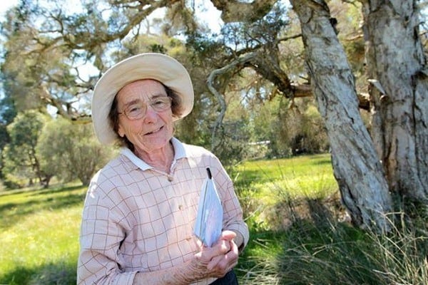 woman standing by tree