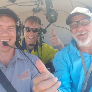 Pilot and spotter selfie in the helicopter looking for water hyacinth