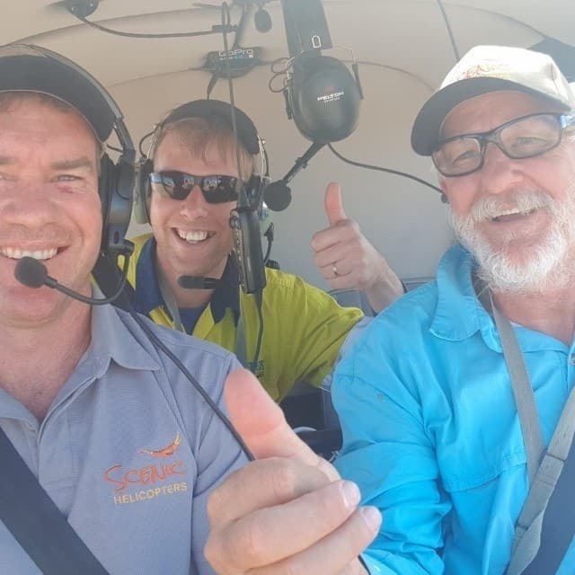Pilot and spotter selfie in the helicopter looking for water hyacinth