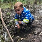 child planting at Gooralong Brook, Jarrahdale