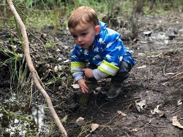 child planting at Gooralong Brook, Jarrahdale